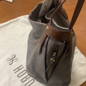 Hobo brand bag with Saddle brown handle.